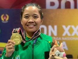 Pemenang Wushu Women's Sanda 48 kg Junita Malau (https://sports.okezone.com)