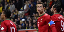 JONATHAN NACKSTRAND / AFP Penyerang Portugal Cristiano Ronaldo merayakan gol ke gawang Swedia dalam leg kedua play-off