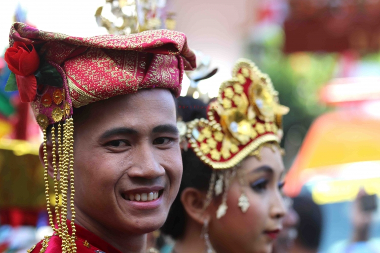 Senyuman dari salah satu anggota kontingen Ikatan Keluarga Pelajar dan Mahasiswa di Jogja (dok. pribadi)