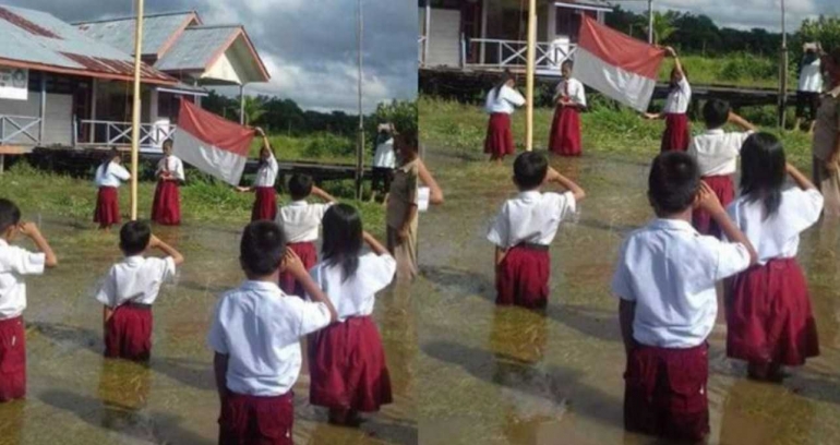Meski banjir, siswa tetap melaksanakan upacara bendera 17 Agustus (foto: indonetizen.org)