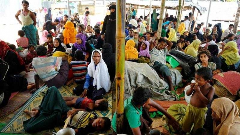 Newly arrived Rohingya refugees sit inside a shelter at the Kutupalang refugee camp in Cox's Bazar,(Bangladesh [Mohammad Ponir Hossain/Reuters])