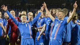 Timnas Islandia merayakan kesuksesan tampil di Piala Dunia 2018. (AFP PHOTO / Haraldur Gudjonsson)
