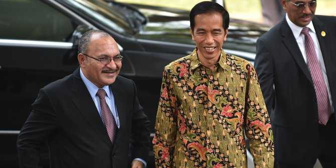 Presiden Joko Widodo ketika menyambut PM Papua Nugini (Foto : merdeka.com)