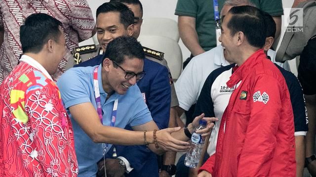 Sandiaga Uno saat bertemu Jokowi di Aquatic Center pada perhelatan Asian Games 2018 (liputan6.com).