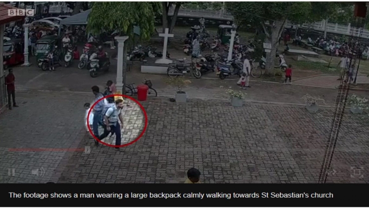 Sumber: screen-shot rekaman video yang memperlihatkan seorang lelaki dengan rangsel yang terlihat berat di punggungnya, memasuki halaman gereja St. Sabastian, Negombo, dan beberapa saat kemudian terjadi ledakan (bbc.com)