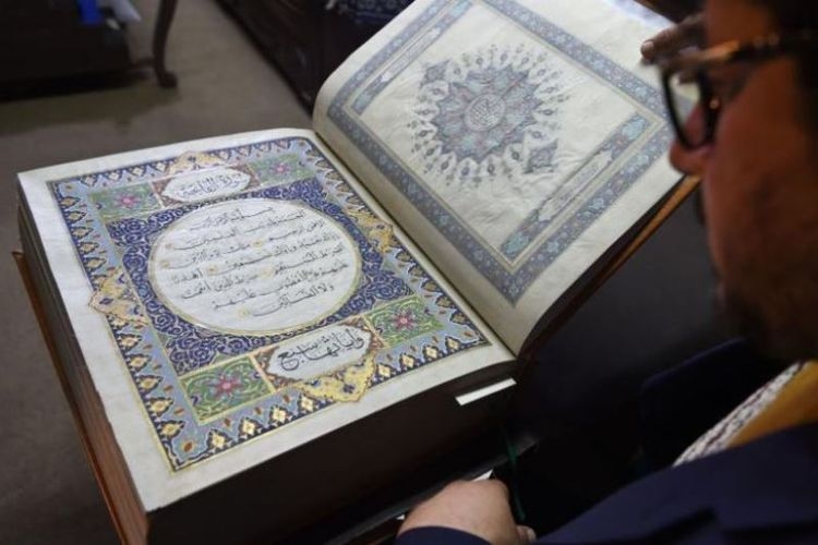 ilustrasi membaca Quran. (AFP/Wakil Kohsar)