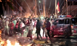 Kerusuhan 22 Mei [Foto: Dita Alangkara/AP]