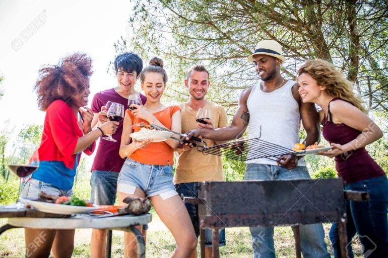 https://www.123rf.com/photo_79816487_happy-multiracial-friends-having-fun-at-picnic-barbecue-garden-party.html
