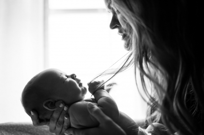 woman holding baby-picture by Zach Lucero on unsplash.com