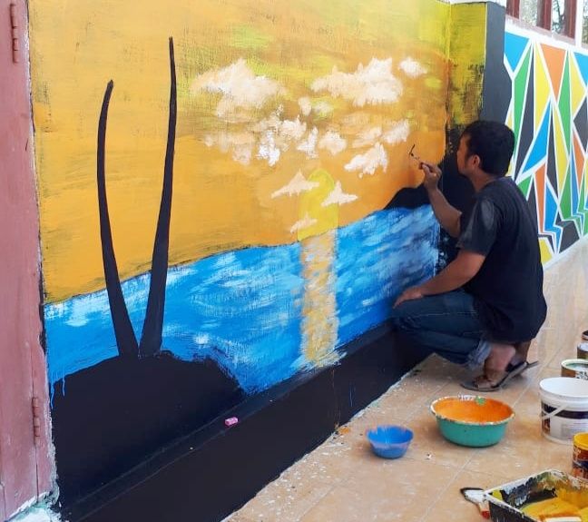 Efendi, the Headmaster of MA PP. Nurul Falah, leads the building decoration. (Private Document)