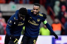 Saka berhasil cetak gol untuk membawa Arsenal terhindar dari kekalahan dan juara grup F Liga Eropa 2019/20. (Kompas.com/AFP)