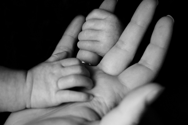 baby holding fingers-photo by Liv Bruce on unsplash