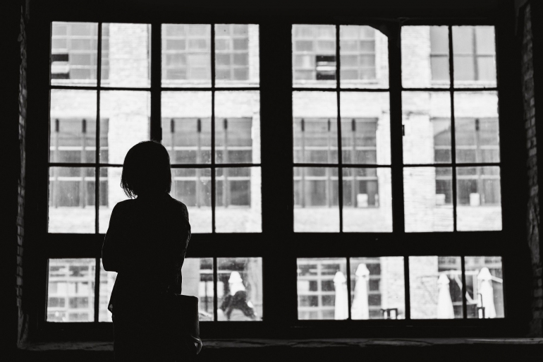 woman facing the window-photo by Alex Ivashenko from unsplash