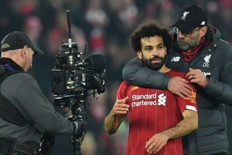 Mohamed Salah dan Juergen Klopp pada laga Liverpool vs Manchester United dalam lanjutan pekan ke-23 Liga Inggris 2019-2020.(AFP/PAUL ELLIS) 