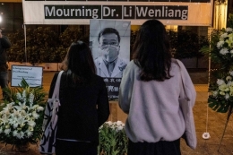 Mourners at a vigil for Dr. Li Wenliang on Friday.Credit...Lam Yik Fei for The New York Times