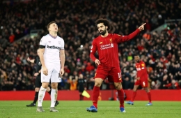 Mohamed Salah usai mencetak gol penyeimbang kedudukan kala Liverpool menjamu West Ham (Getty Images).