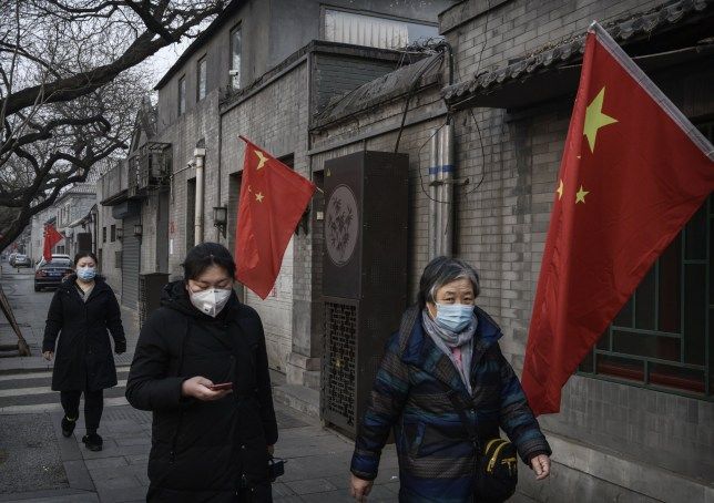Chinese women wear protective masks on the street during the Chinese New Year and Spring Festival holiday on January 28, 2020, in Beijing (Source: Getty Images AsiaPac)
