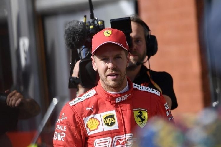 Pebalap Ferrari, Sebastian Vettel, seusai menjalani sesi kualifikasi F1 GP Belgia di Sirkuit Spa-Francorchamps, 31 Agustus 2019. (AFP/JOHN THYS via KOMPAS.com)