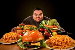 Obesitas, salah satu penyakit akibat terlalu banyak makan (kompas.com)