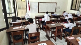 siswa SMP N 1 Kudus mengikuti Ujian Sekolah secara tatap muka pada Senin, (19/4/2021). (Dokumentasi: Tribun Jateng/ Yunan)