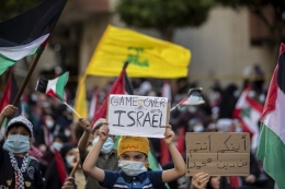 Arak-arakan klaim kemenangan Palestina atas Israel. Sumber: AP Photo/Hassan Ammar melalui Kompas.com