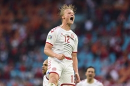 Ekspresi Kasper Dolberg seusai mencerak gol pada laga 16 besar Euro 2020 yang mempertemukan Wales vs Denmark di Johan Cruyff Arena, Amsterdam, Belanda, pada Sabtu (26/6/2021) malam WIB.(AFP/ OLAF KRAAK) 