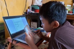 ilustrasi siswa belajar gunakan laptop (Sindonews)