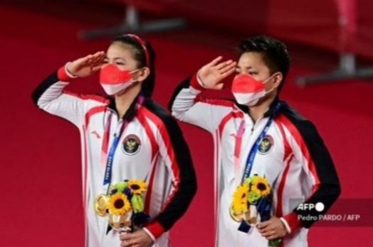 Pasangan Greysia Pollii dan Apriyani Rahayu sumbang emas untuk Indonesia. Doc Pedro Pardi/AFP  