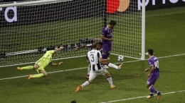 Gol Asensio menutup kemenangan Real Madrid atas Juventus di Final Liga Champions 2017. Sumber: Reuters/Phil Noble