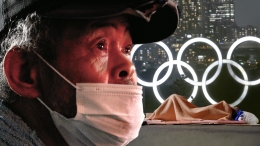 Siluet seorang Tunawisma berlatar belakang banner Olimpiade