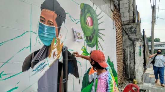 Mural protokol kesehatan di Medan|dok. suara.com/Muhlis