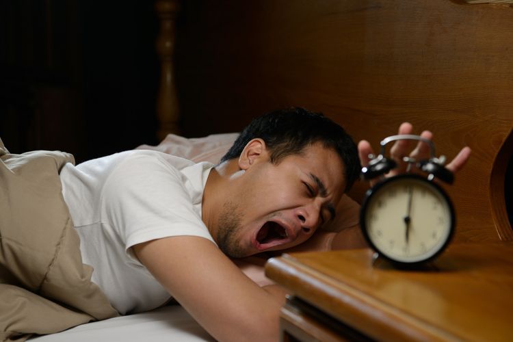 Ilustrasi seseorang yang malas bangun tidur. Sumber: Kompas.com