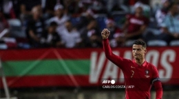 Pemain Portugal, Cistiano Ronaldo usai mencetak gol ke gawang Luxemburg | Foto: Carlos Costa/AFP