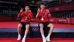 Sumber foto : indosport.com | Ilustrasi ketika Huang Dong Ping/Wang Yi Lyu berhasil meraih medali emas di Olimpiade Tokyo 2020