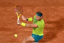 Petenis Spanyol, Rafael Nadal, melangkah ke partai final Roland Garros 2022. Dia berpeluang juara Grand Slam untuk ke-22 kalinya.(AFP/KMSP/Millereau Philippe)