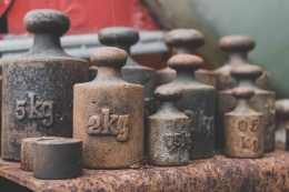 https://www.pexels.com/photo/rusty-set-of-iron-weights-for-scale-in-close-up-view-8545561/
