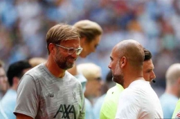 Jurgen Klopp (Liverpool) dan Pep Guardiola (Manchester City). Foto: AFP/Adrian Dennis via Kompas.com