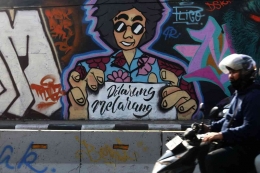 ilustrasi Mural menjadi sindiran terhadap RUU KUHP. (Foto: KOMPAS/HERU SRI KUMORO (KUM))