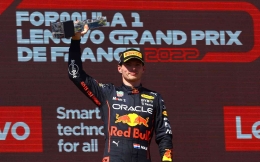 Verstappen lifts the trophy (Mark Thompson getty)