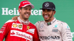 Lewis Hamilton dengan Sebastian Vettel (formula1.com)