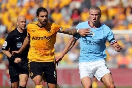 Erling Haaland berhasil menyumbang 1 gol atas kemenangan Man City kontra Wolves di Liga Inggris pekan ke-8. Foto: AFP/Geogg Caddick via Kompas.com