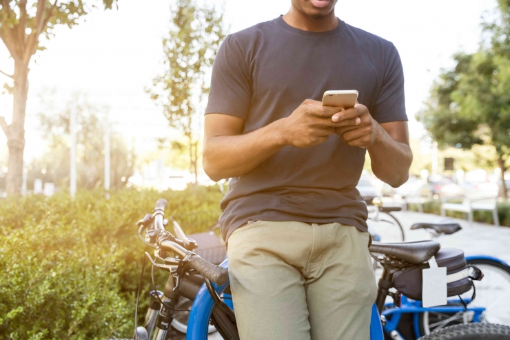 Photo man using phone by LinkedIn Sales Navigator