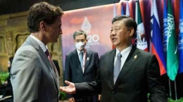 Presiden Xi Jinping dan Justin Trudeau PM Kanada saat menghadiri KTT G20 Indonesia (sumber: beritaterheboh.com/jurnalis)