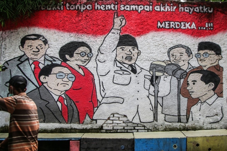 ilustrasi: Mural tujuh presiden Republik Indonesia tergambar secara kartunal di sebuah dinding di kawasan Pisangan, Tangerang Selatan, Banten, Minggu (14/11/2021). (Foto: KOMPAS/HENDRA A SETYAWAN)