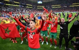 Selebrasi Pemain Maroko setelah menyingkirkan Portugal dibabak Perempatfinal Piala Dunia 2022. (Foto: AFP/KIRILL KUDRYAVTSEV)