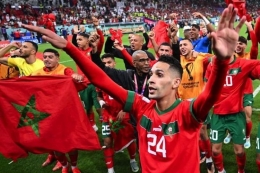 Timnas Maroko merayakan kemenangan mereka atas Portugal di babak perempat final Piala Dunia 2022. (Foto: GETTY IMAGES via BBC INDONESIA/kompas.com) 