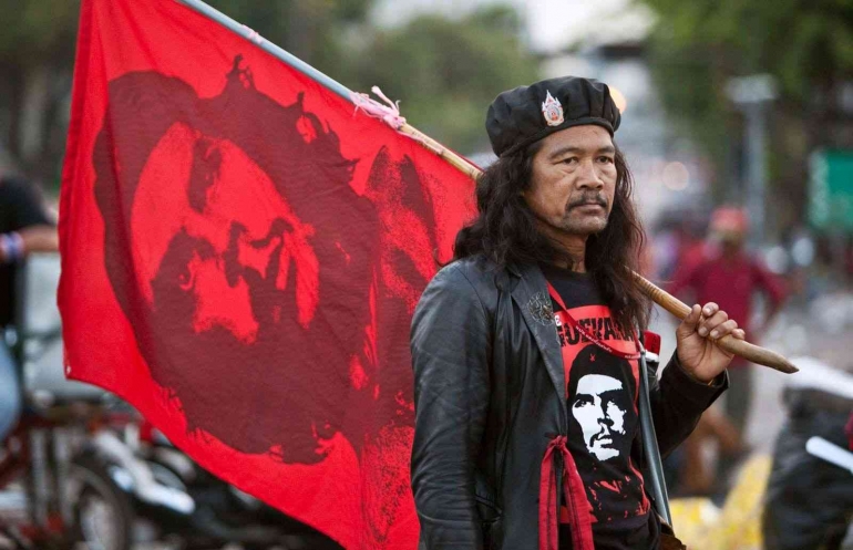https://cdn.britannica.com/09/185409-050-49A64B72/Demonstrator-flag-image-Cuban-Che-Guevara-Bangkok-2010.jpg