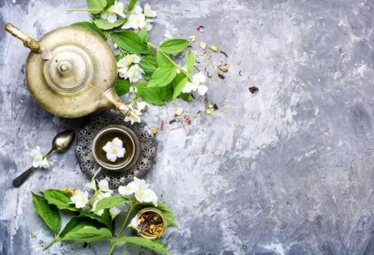 Oriental tea set with tea from jasmine flowers. Jasmine tea - (Photo by Nikolay_Donetsk)