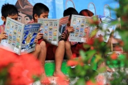 Ilustrasi Anak-Anak SD sedang membaca. Kompas.com
