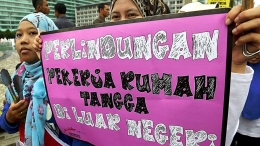 ilustrasi: Unjuk rasa pekerja rumah tangga saat memperingati Hari Perempuan Internasional di Jakarta, Minggu (8/3/2015). (Foto: KOMPAS/HERU SRI KUMORO)